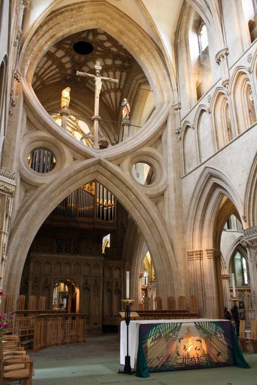 a very large cathedral with stone arches and ceiling