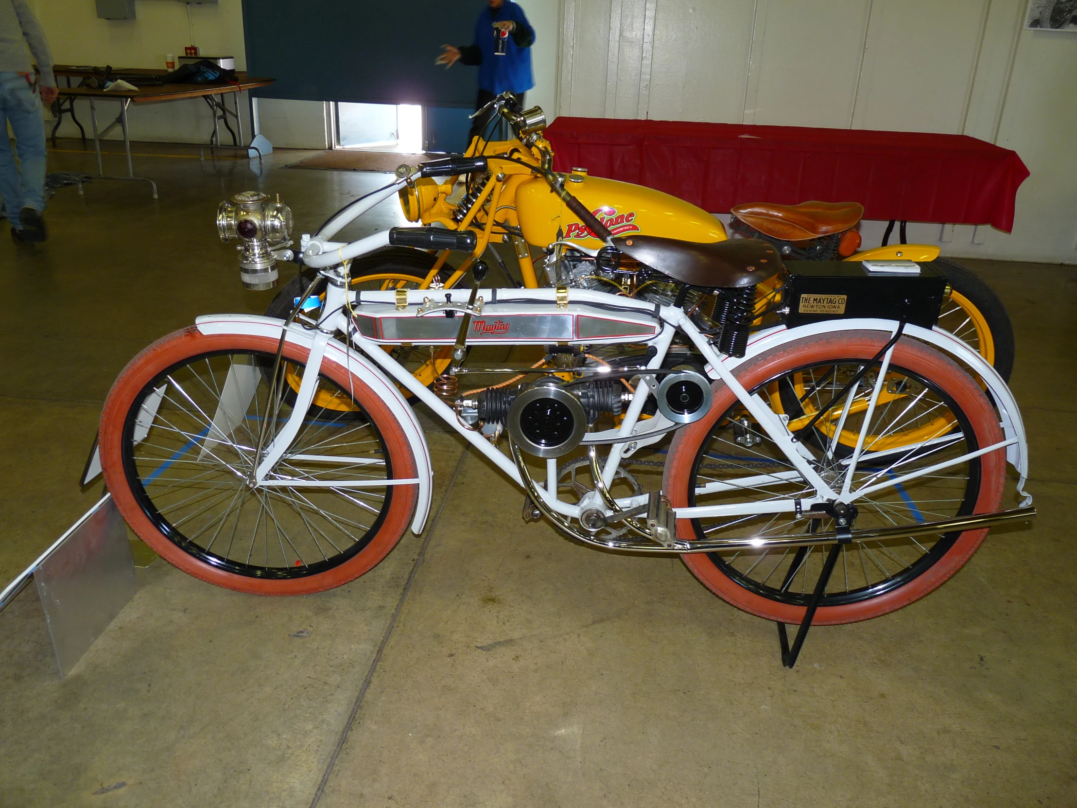 a yellow and white motorcycle with red rims