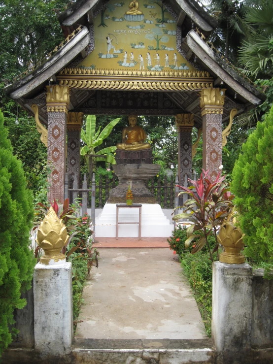 the pavilion is near the trees and shrubs