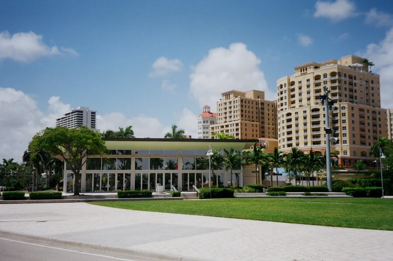 a public building with a glass and wood facade