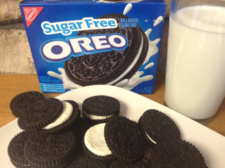 cookies with oreo cut in half and milk next to them