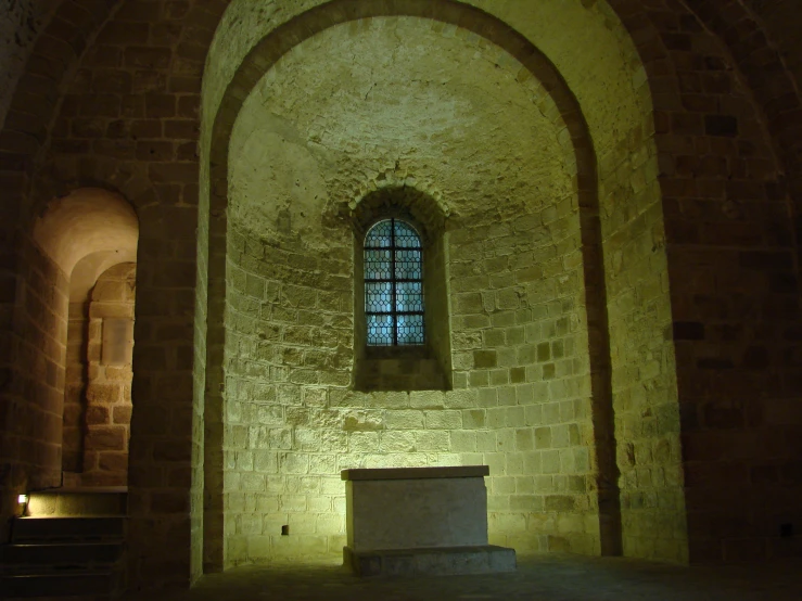 a small room with two tall brick arches