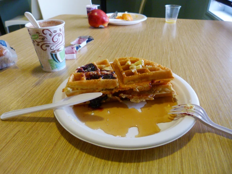 plate with waffles on table in restaurant