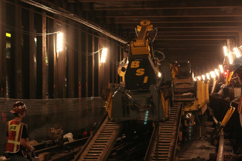 a train sits near several railway tracks