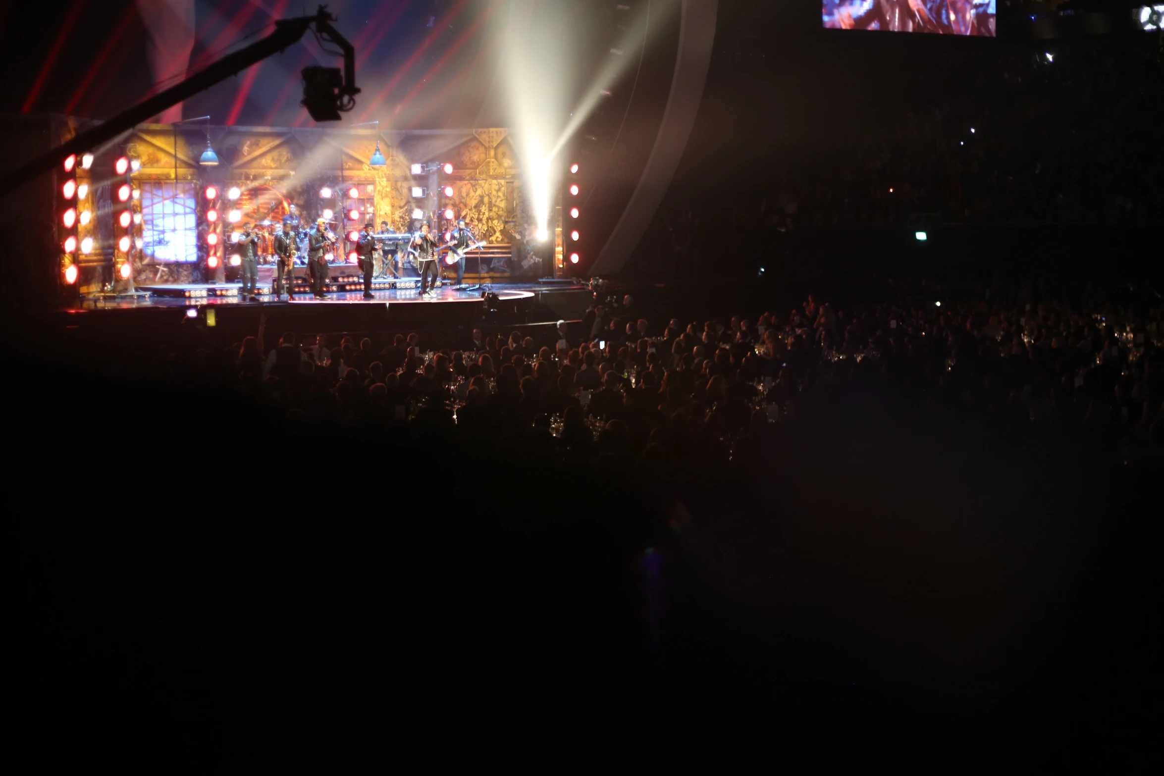 the stage is lit up with brightly colored lights