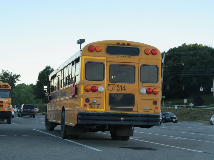 a large yellow school bus is pulling into a station