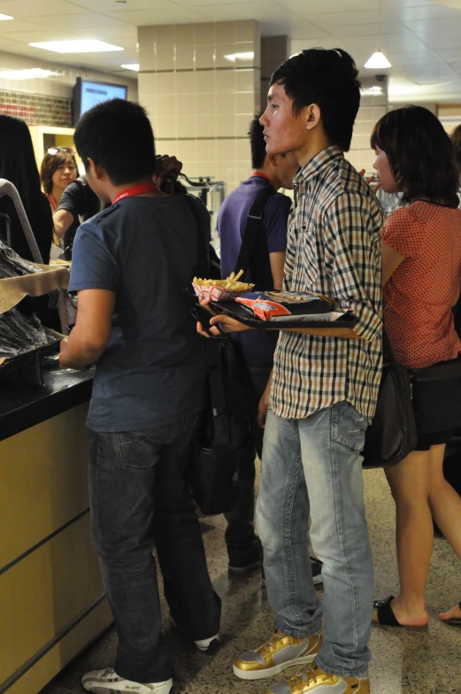 a group of people at a buffet stand