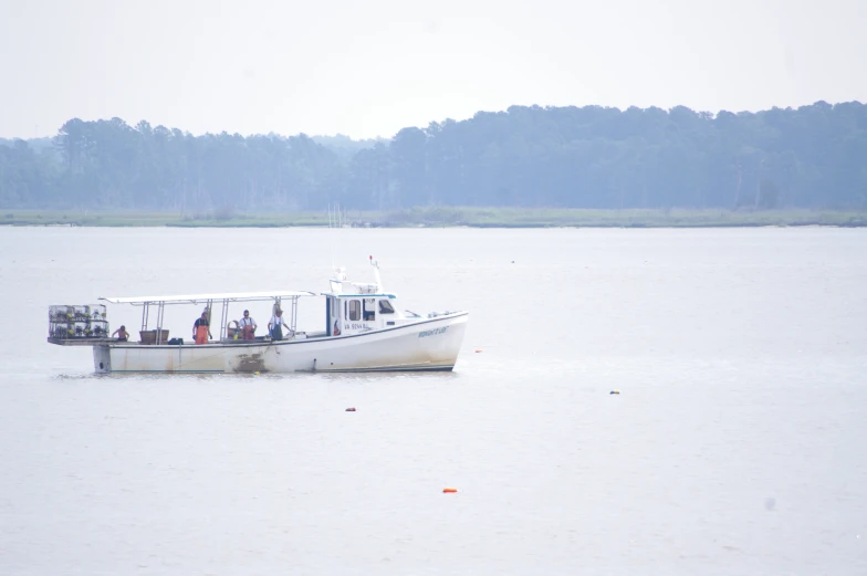 a boat with people on it in the water