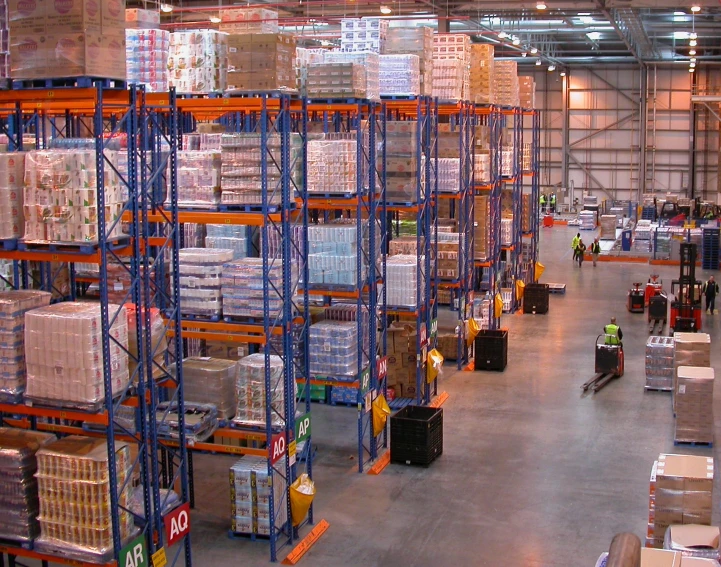 a warehouse filled with lots of pallets and containers
