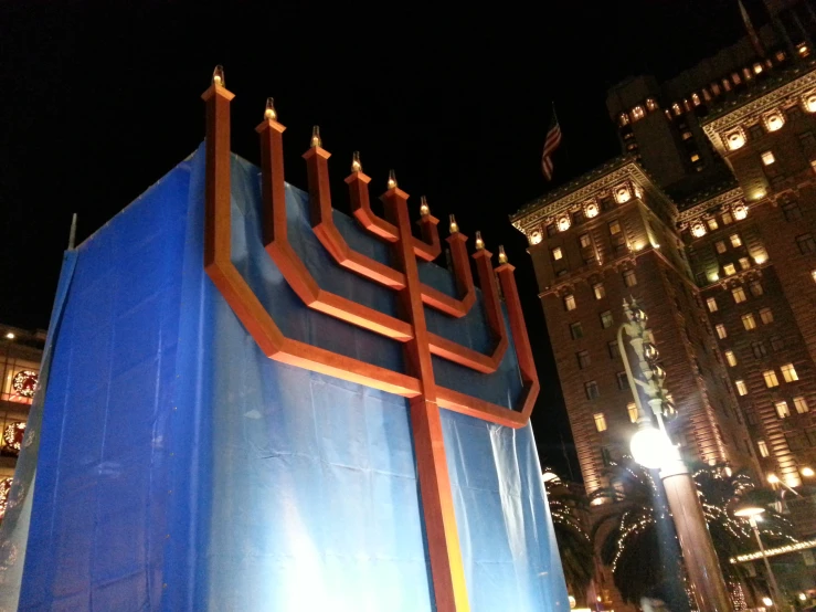 there is a large menorah in the city at night