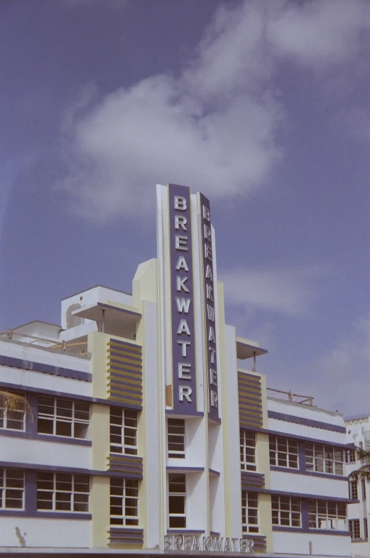 a large el sign and an art deco building