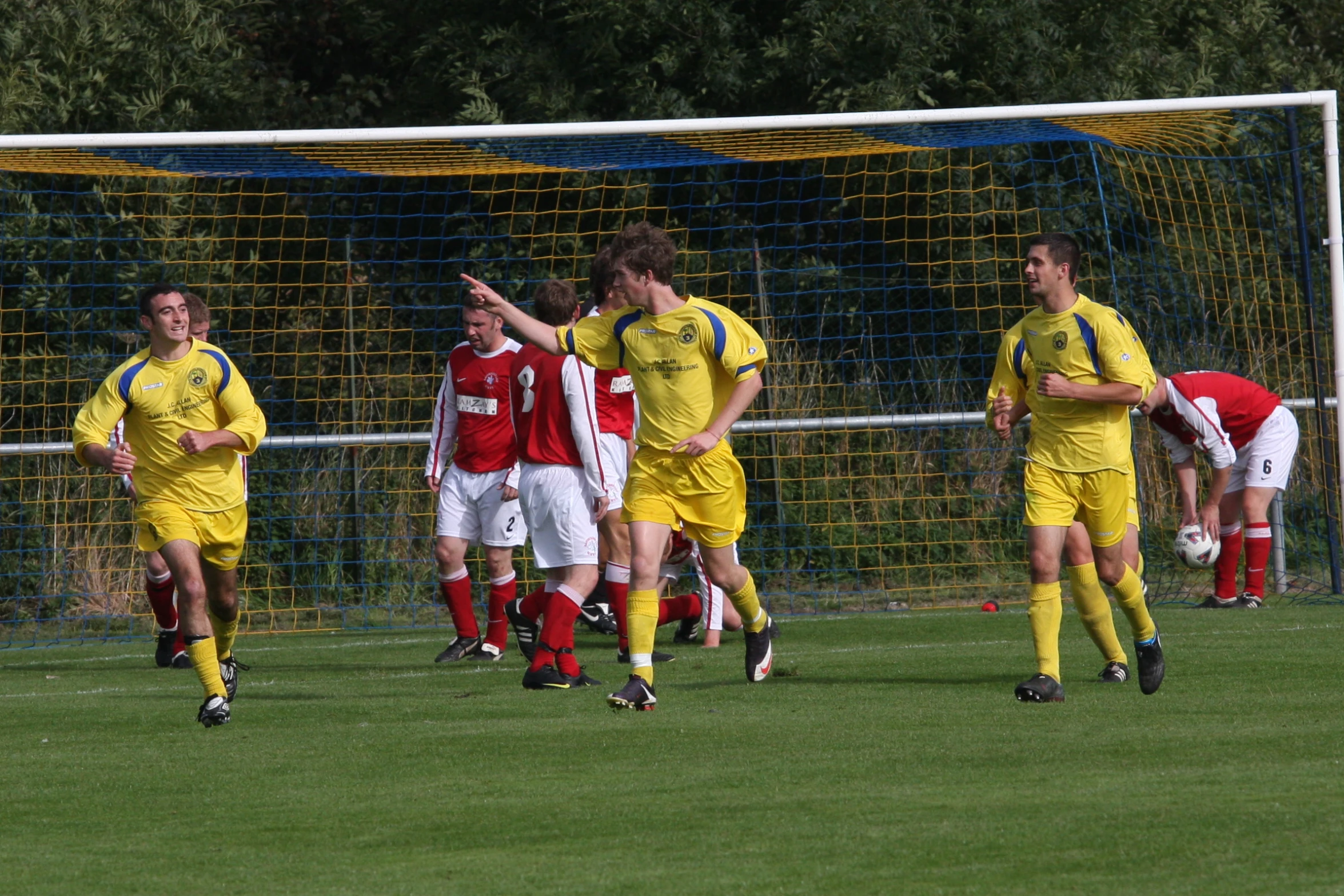 soccer players are all in the yellow uniforms