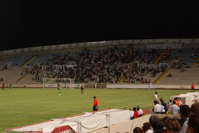 soccer players are on a pitch during a game