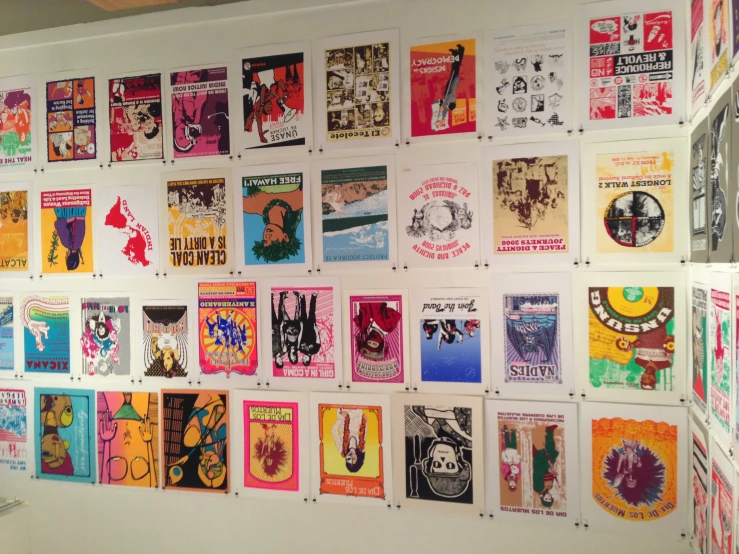 an exhibit display with many different color posters