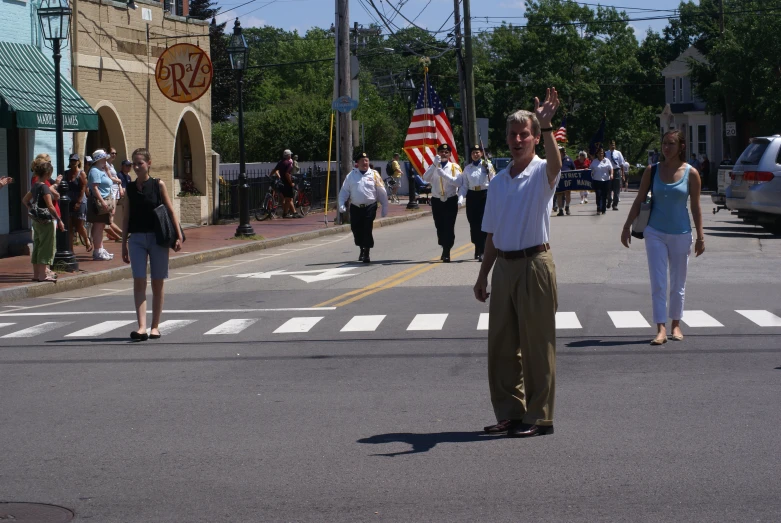 a man with a flag on a street