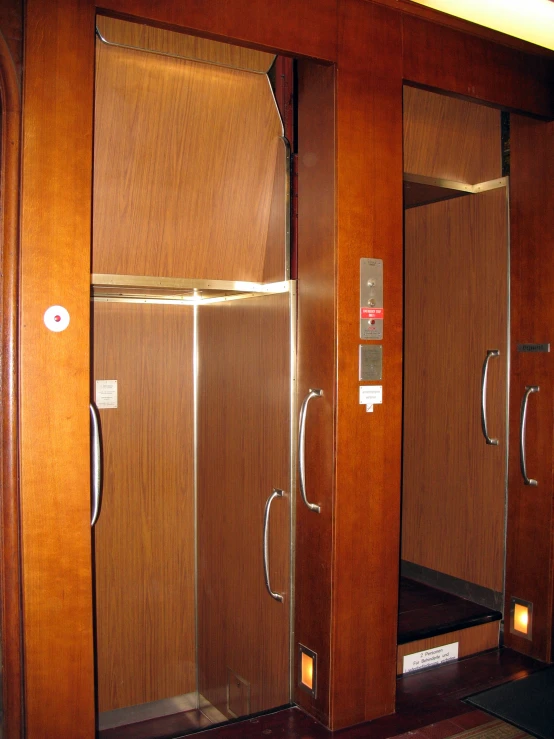 a public restroom with the doors closed
