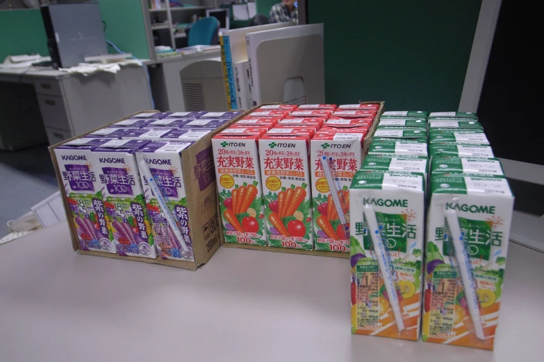 some drinks sitting on a table in boxes