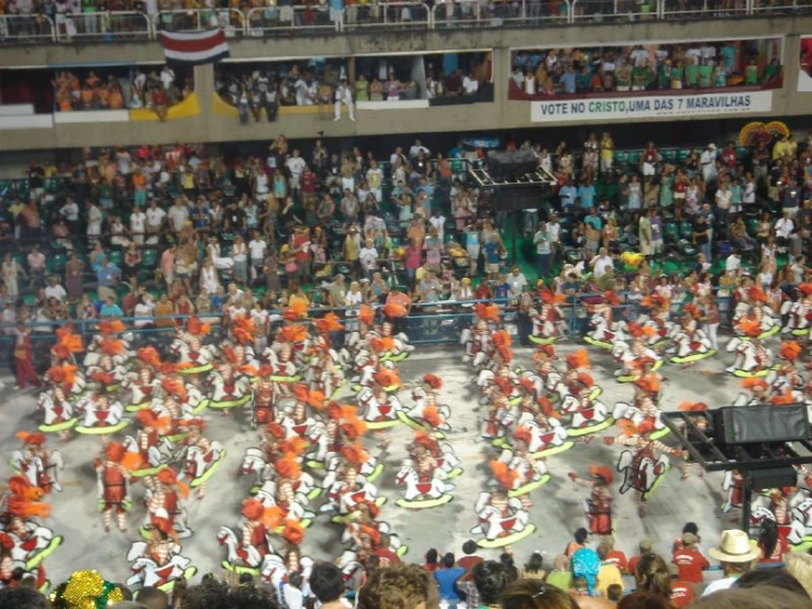 an overhead view of dancers performing in a stadium