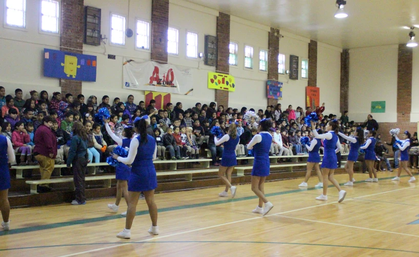 the cheerleaders are dancing together at the competition