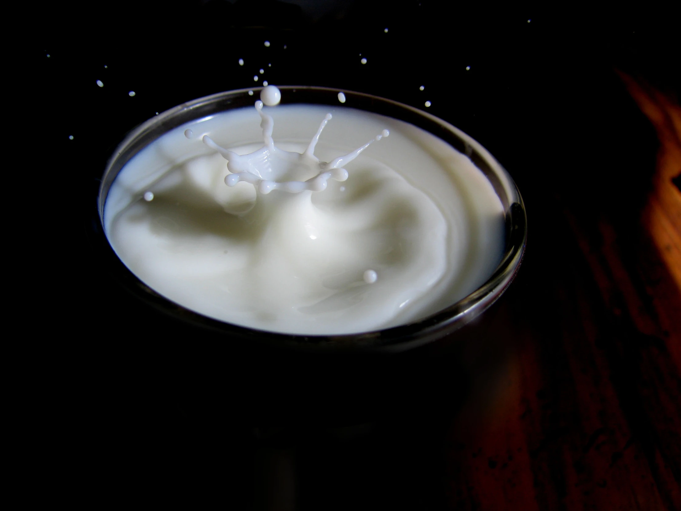 a glass of milk with a white liquid