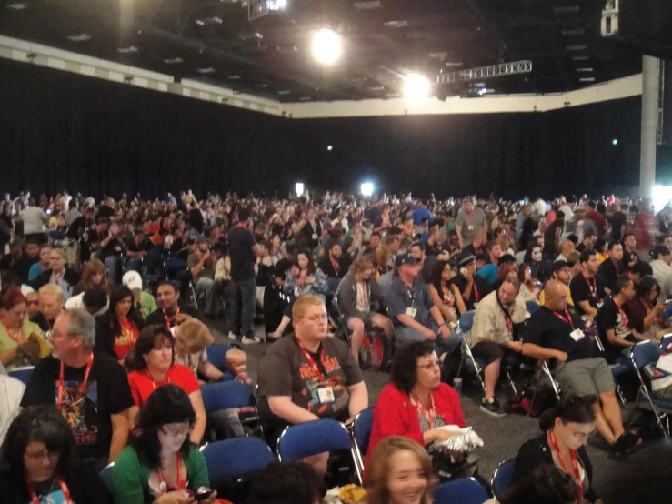 a large group of people with many chairs in front of them