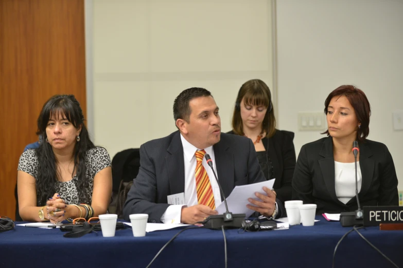 a group of four people sitting at a table