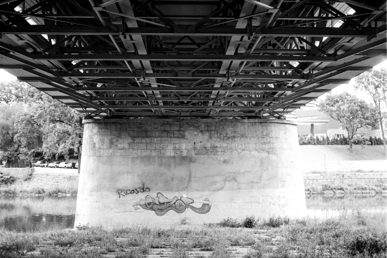 a bridge with graffiti on the top of it
