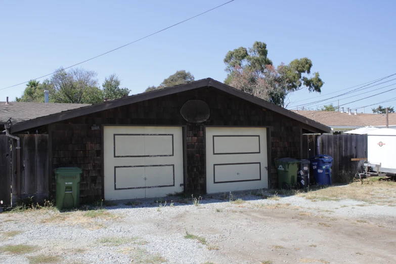 two large doors in a brown wood building