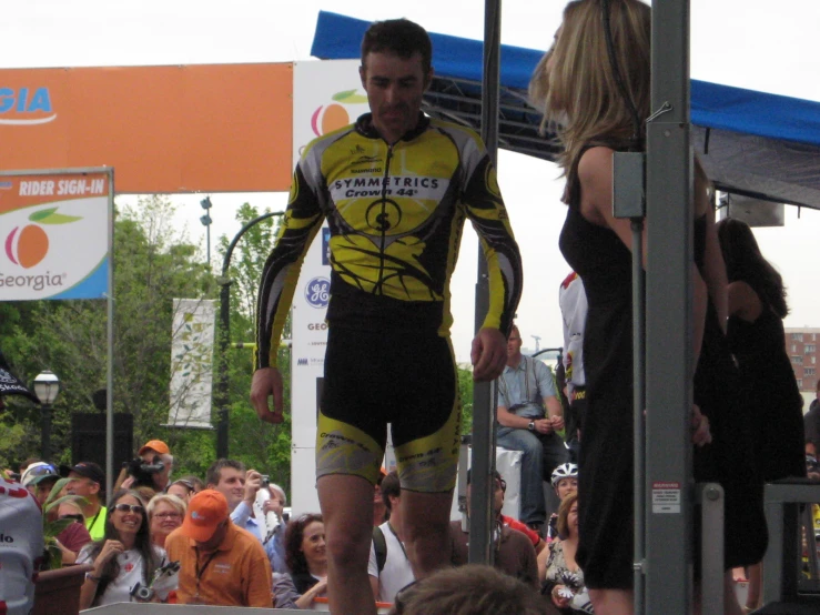 a male athlete walks up to the starting line