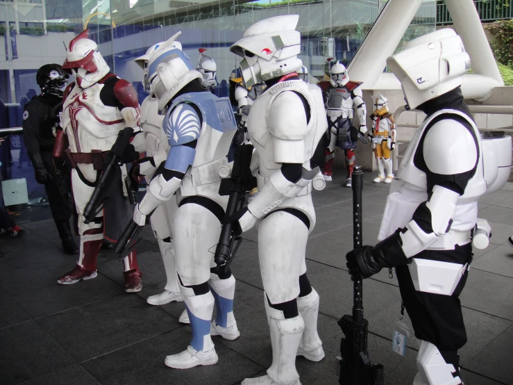 several cosplay costumes on display outside of a building