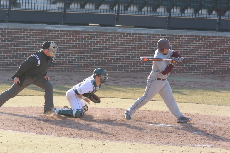 a batter, catcher and umpire on a baseball field