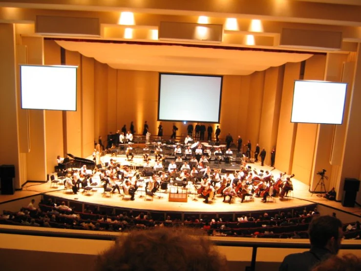 this is a po of a concert with the conductor in front