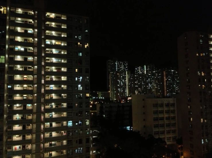 there are many buildings in the city lit up at night