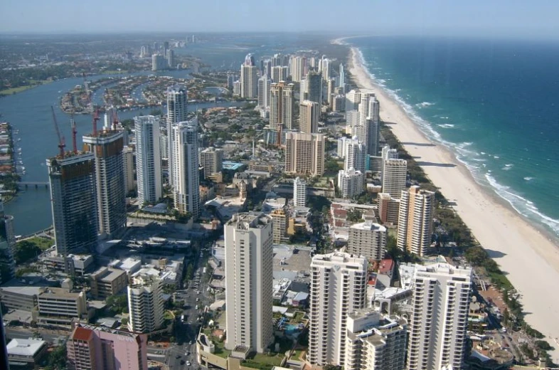 a beach, high rise buildings and city by the sea