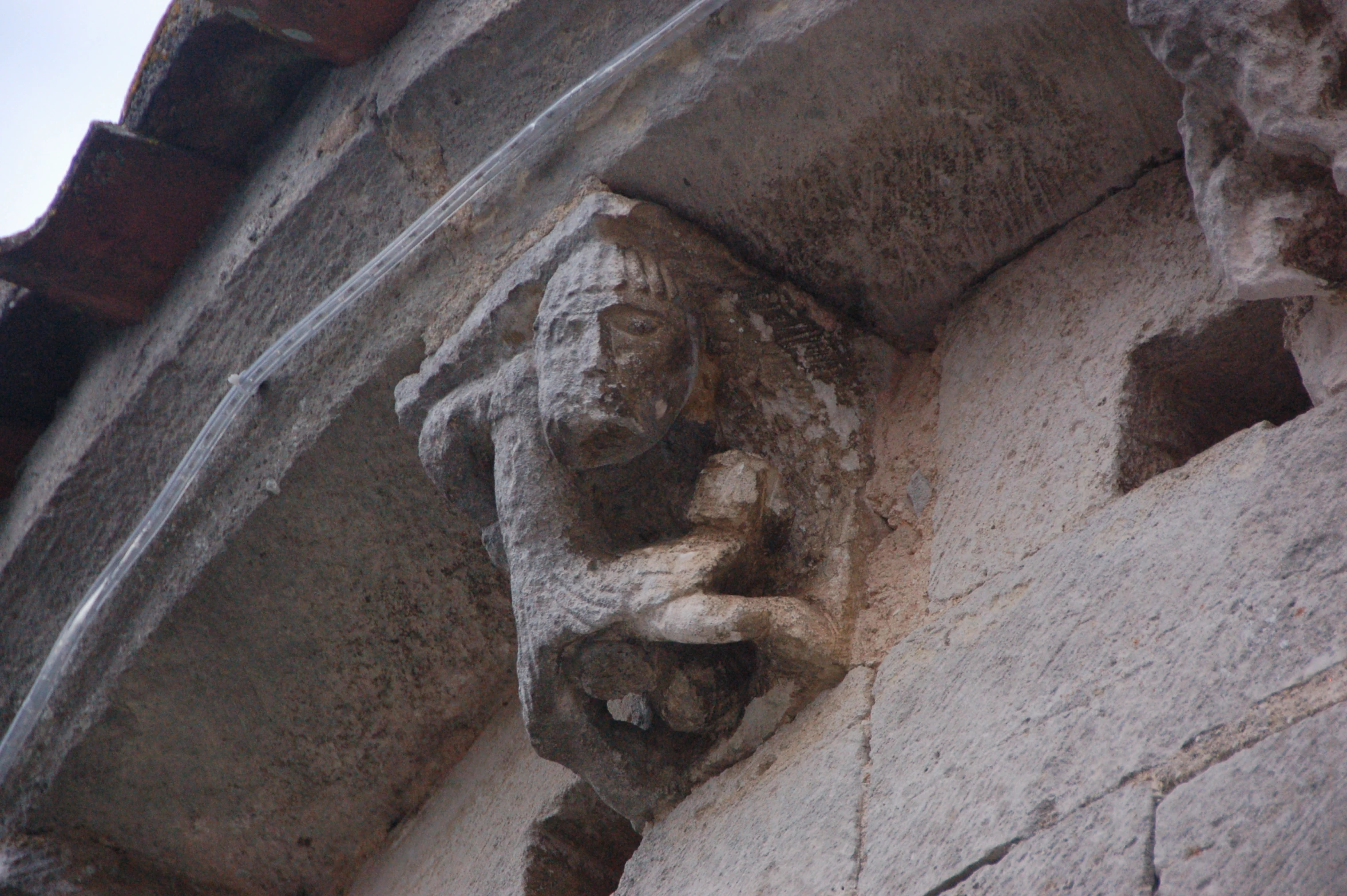 an image of a carved stone statue on a building