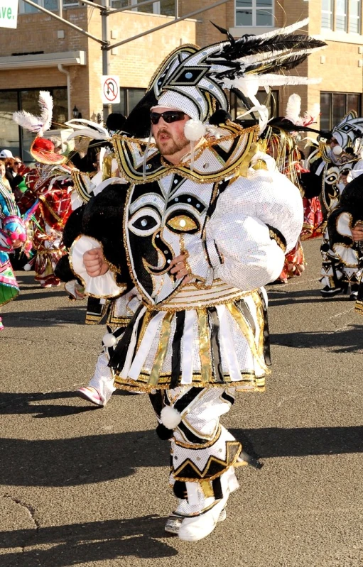 the costumed performers are wearing large hats