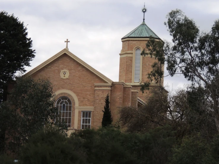 a very old brick church sitting in the woods