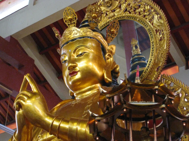 an ornate golden statue in a building