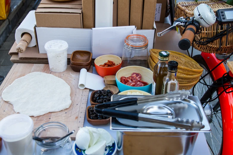 a wooden counter topped with lots of food