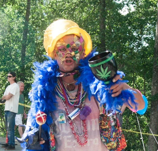 the man is in a carnival with his face painted