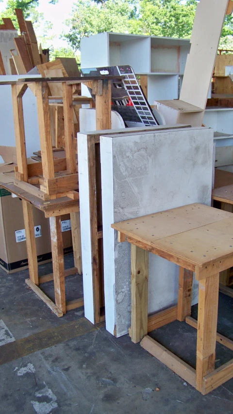 an assembly line that shows several unfinished chairs