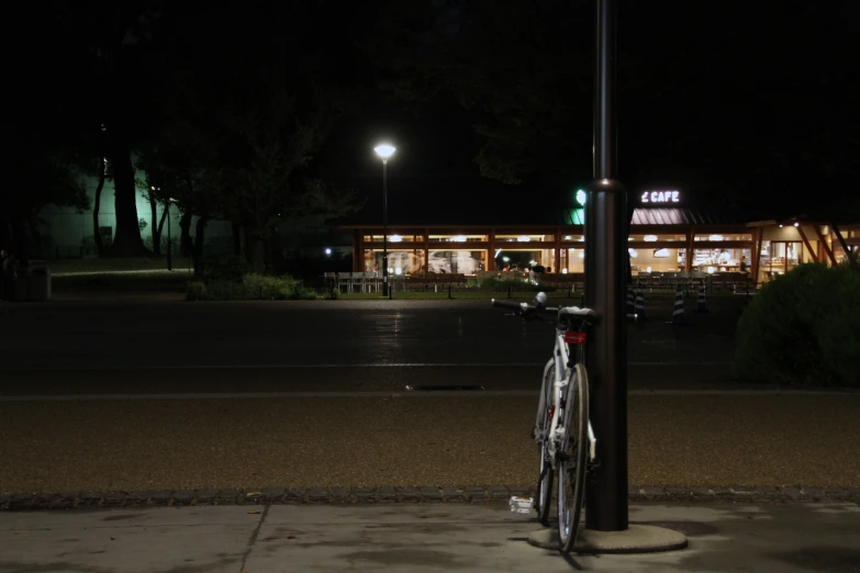 the bike is  up to the pole at the corner