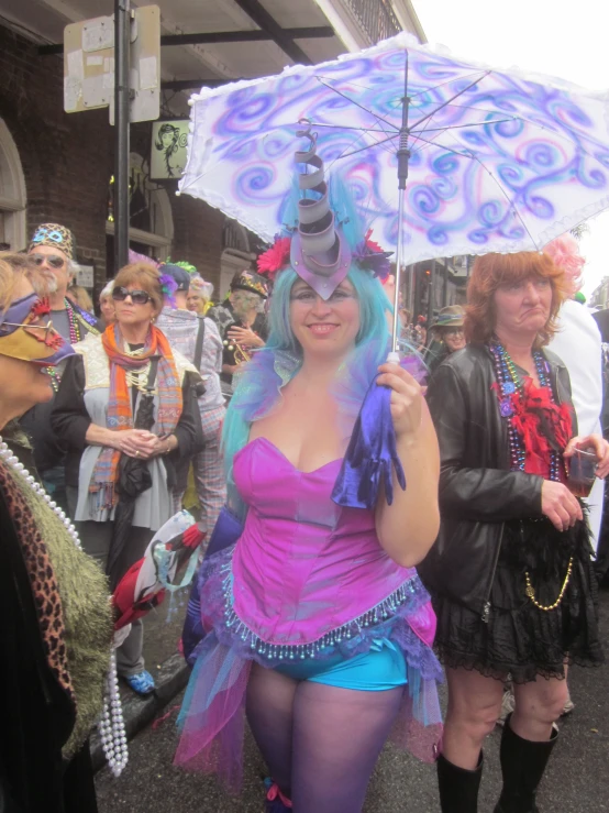 some women in costume walking down the street