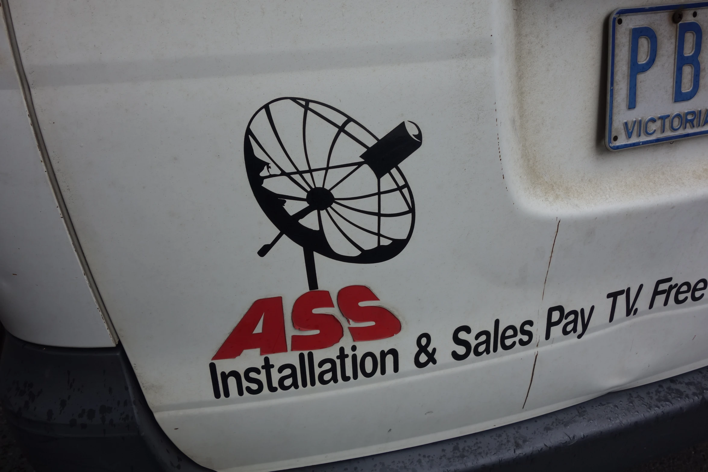 an as installation and sales tax television logo on a white van