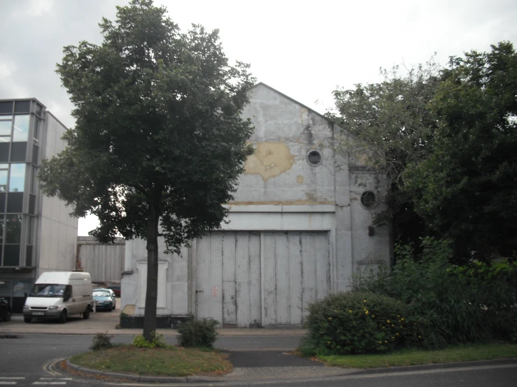 an old building that has been painted a light grey