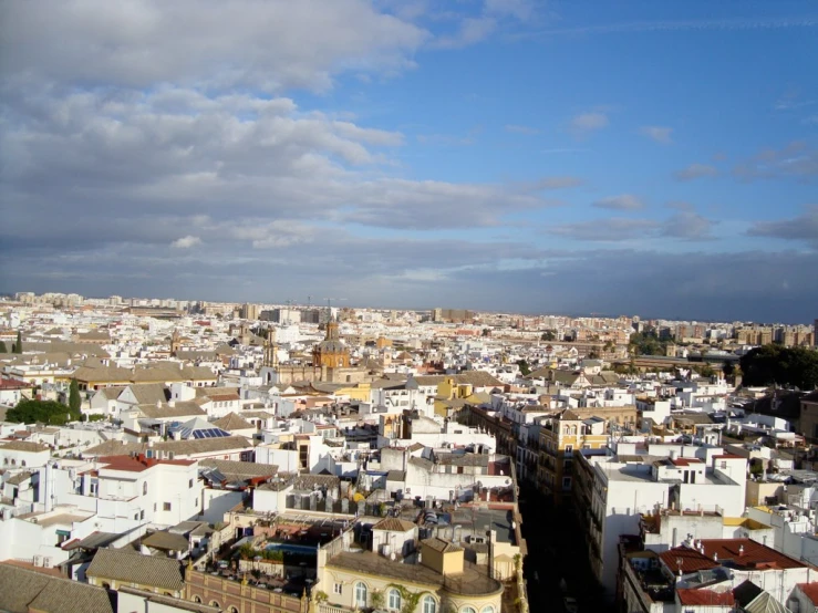 a view of some old buildings and clouds