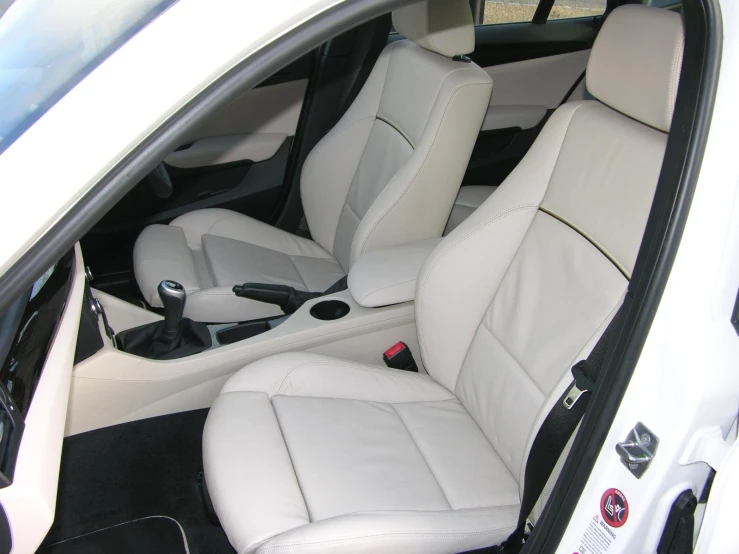 a car with some white leather seats inside of it