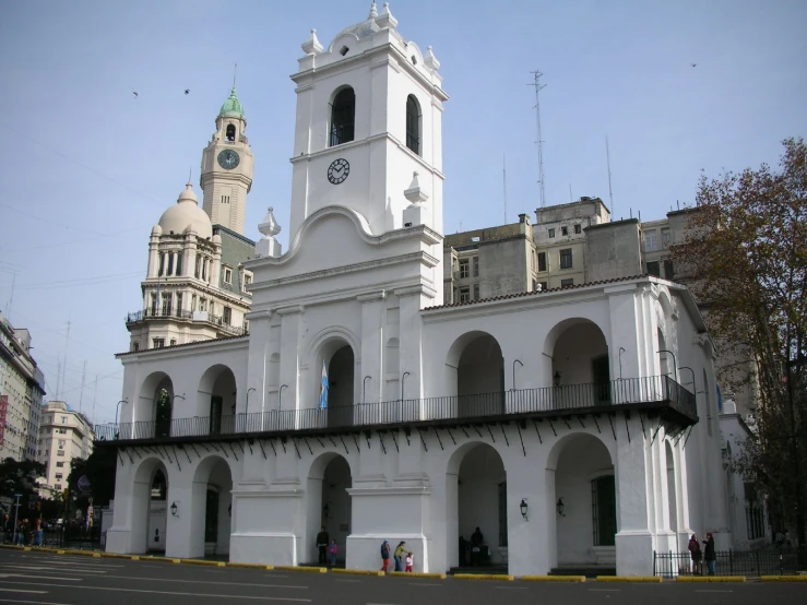 an ornate building with a bell tower and large clock