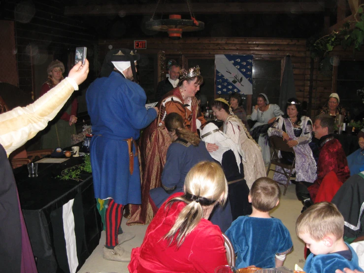 a group of people dressed in costumes standing next to each other