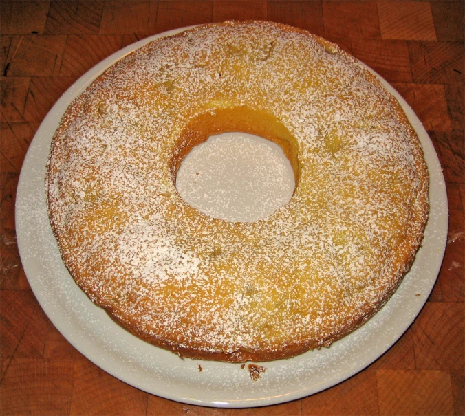 a bundt cake on a plate with powdered sugar